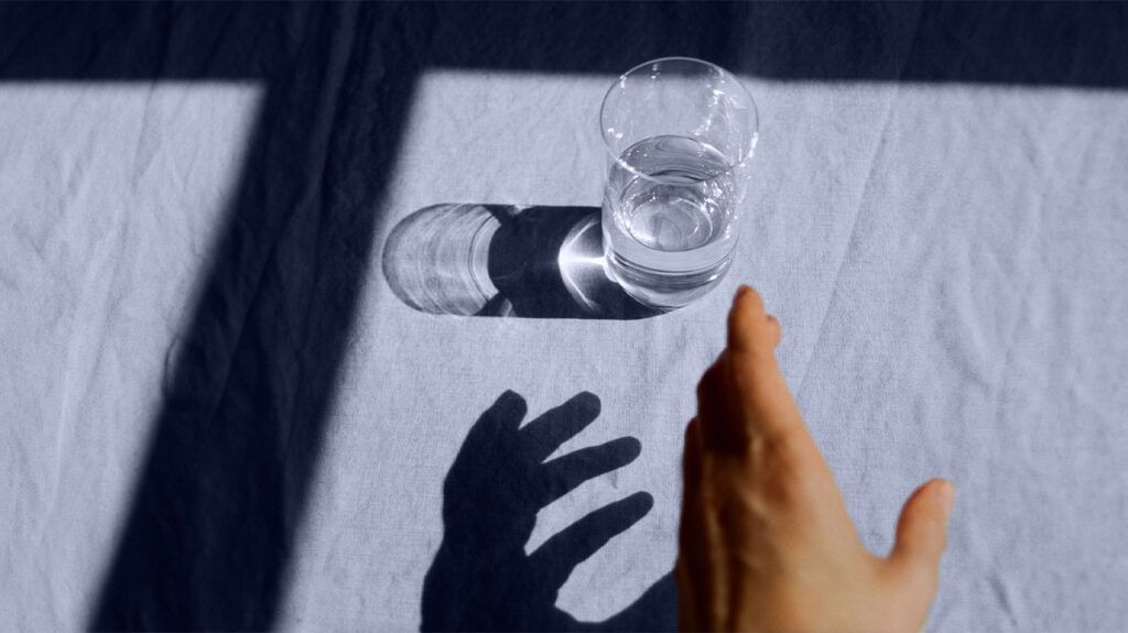 hand-reaching-water-glass-1296x7